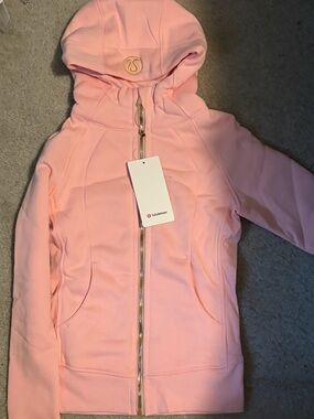 Lululemon Light Pink Scuba Jacket with Gold Zipper
Size Small